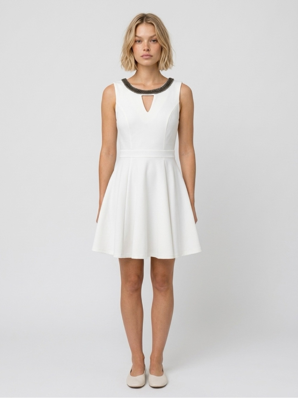 XOXO women’s Sleeveless White Fit & Flare Dress with Embellished Neckline.